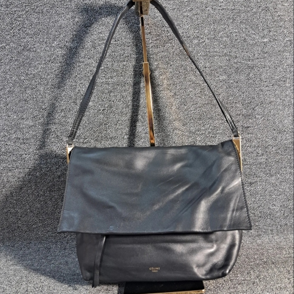 Celine Flap Clasp bag in black calfskin leather.
